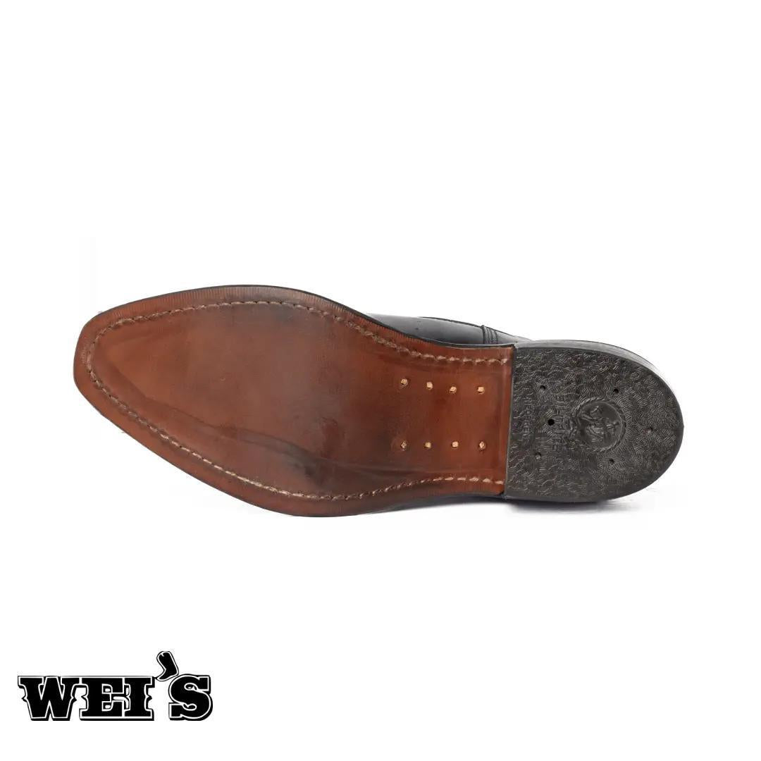 Dayton Black Beauty full-grain leather boot, bottom-up view of the heavy-duty oil-resistant outsole.