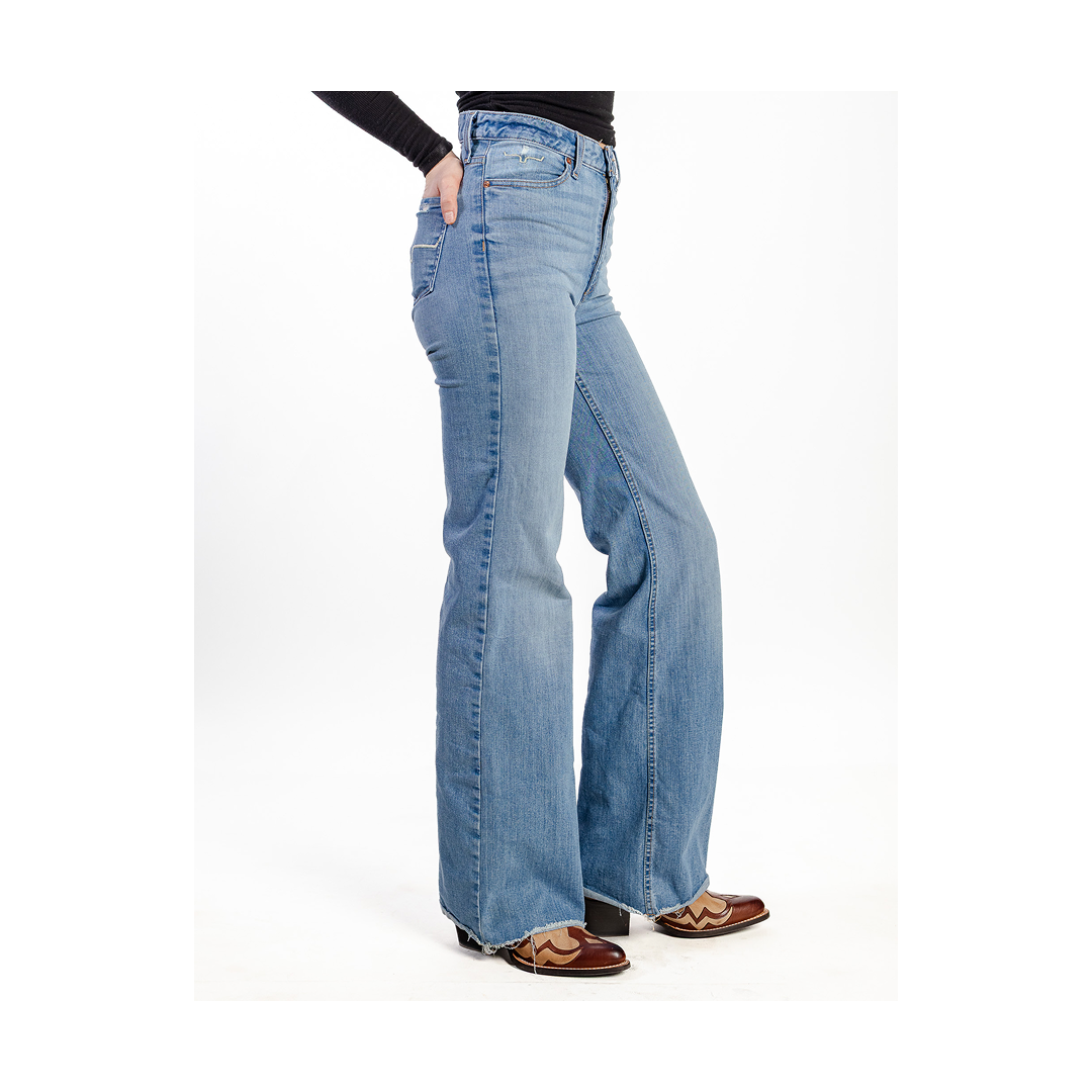 Blue jeans worn by a person on a white background