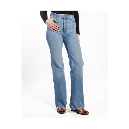 Light blue jeans worn by a person on a white background