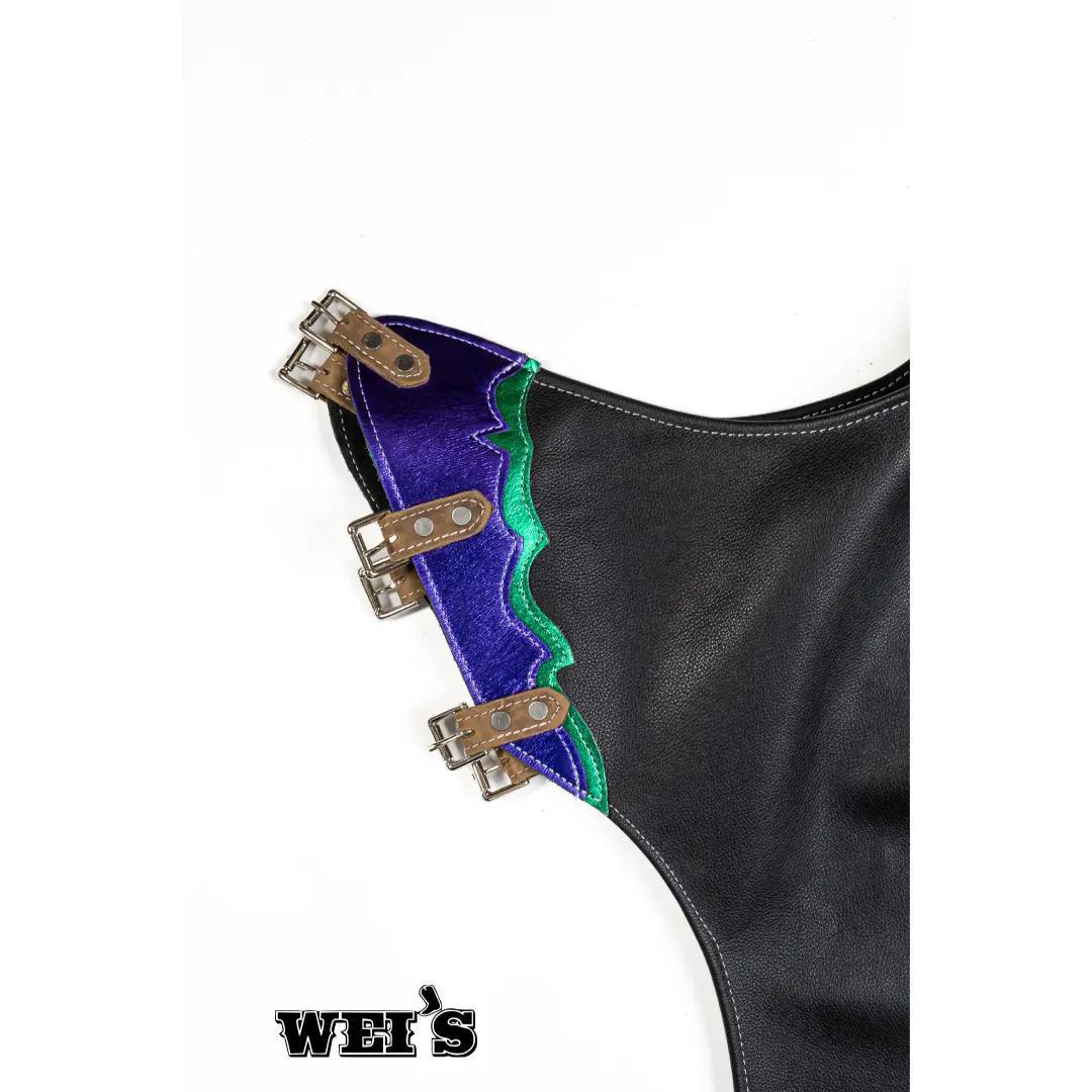 Saddle Barn Pro rough stock leather rodeo chaps showing close-up of adjustable leg straps and buckle hardware.
