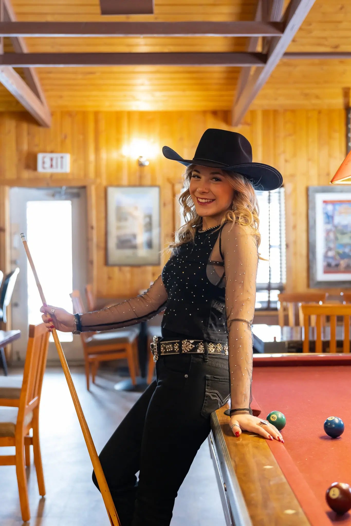 Stetson Trilogy 6X cowboy hat in black fur felt, pool table room lifestyle view.