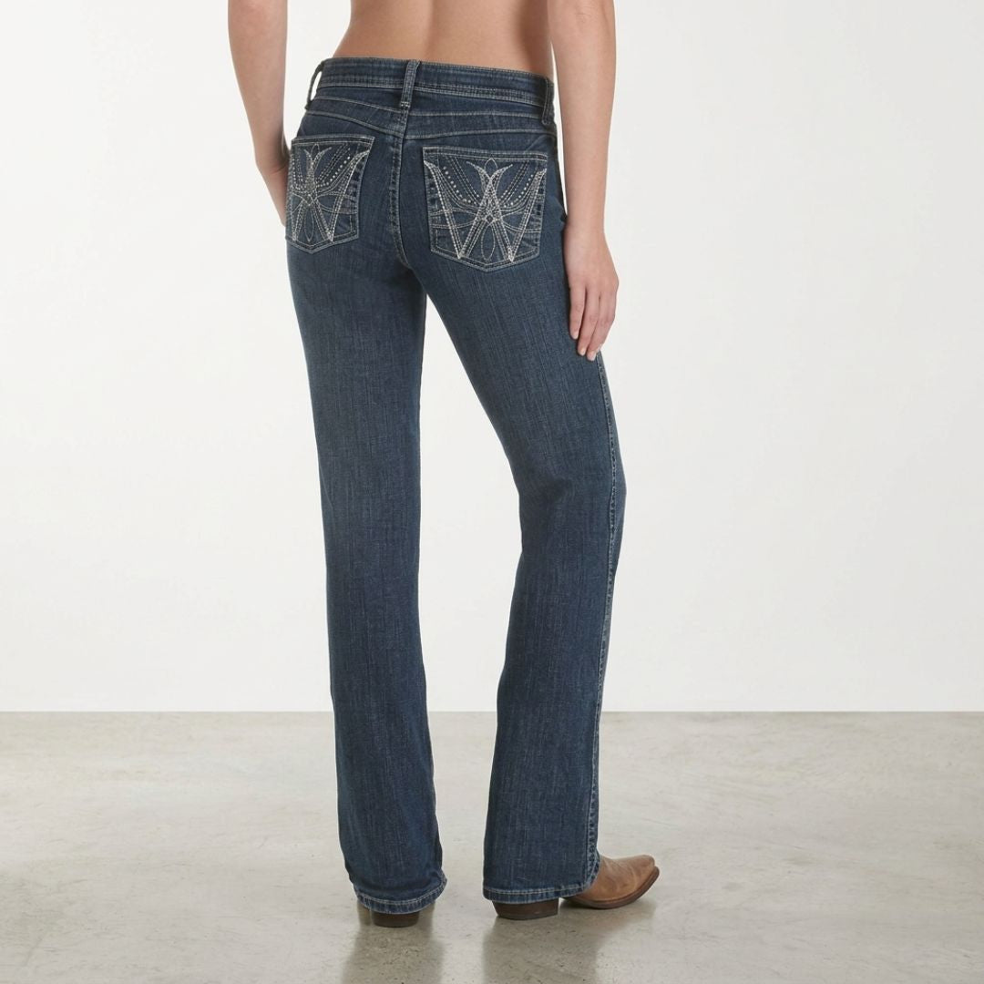 Wrangler Q-Baby mid-rise bootcut jeans in medium wash denim, back pocket view on model.