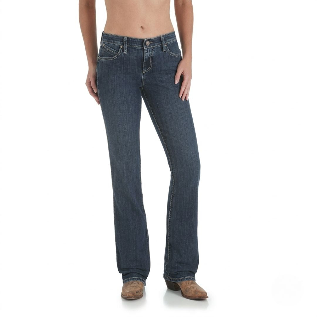 Wrangler Q-Baby mid-rise bootcut jeans in medium wash denim, full side profile view on model.