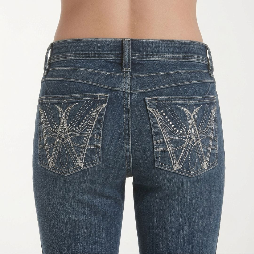 Wrangler Q-Baby mid-rise bootcut jeans in medium wash denim, close-up back pockets view.