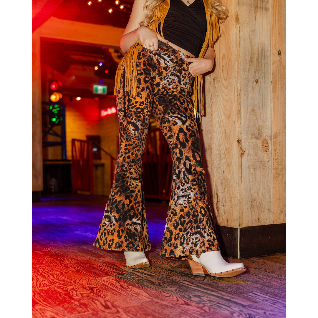 Wrangler X Lainey Wilson leopard print bell bottom jean, full-length back view.